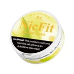 Angled view of yellow NicFit Mango Flame nicotine pouches can showing branding and 21+ age warning label