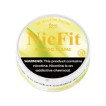 Angled view of yellow NicFit Mango Flame nicotine pouches can showing branding and 21+ age warning label